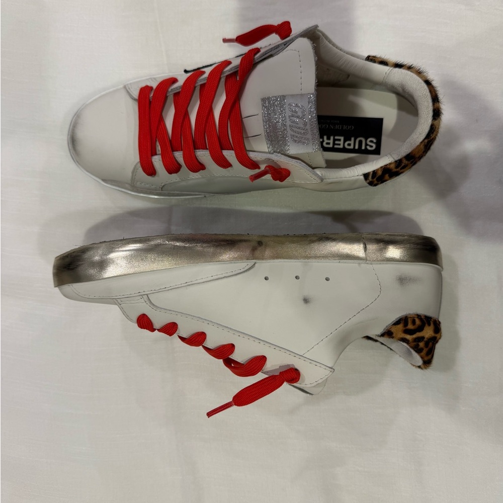 golden goose Super-Star sneakers with leopard-print heel tab and red
laces